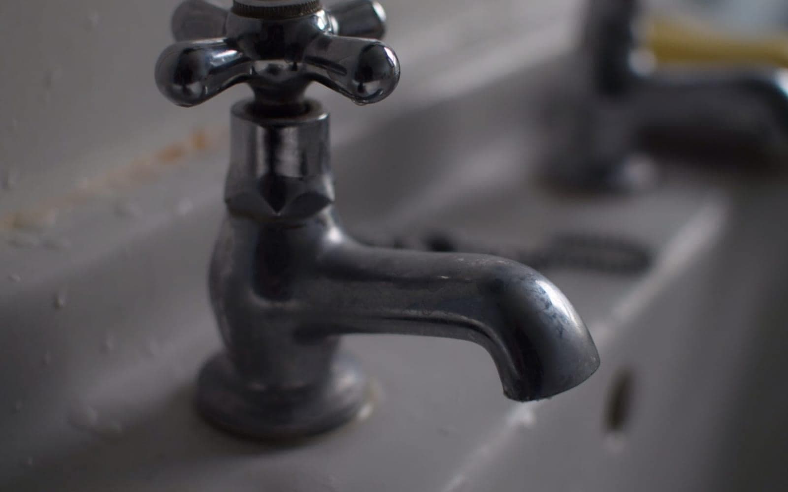 Close-up of a bathroom tap over a sink